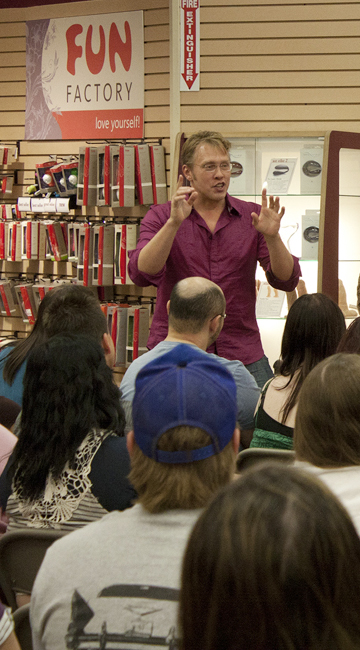 Sex and relationship expert Reid Mihalko of ReidAboutSex.com in front of a room full of adults teaching one of his many workshops.