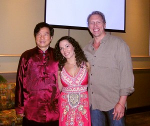 Taoist sexual energy master and author Mantak Chia posing for a picture with Tantra educator Triambika and sex and relationship expert Reid Mihalko