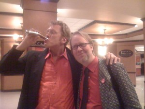 Sex and relationship expert Reid Mihako drinking out of a prototype, stainless steel, dildo flask created by NJoy founder Greg DeLong