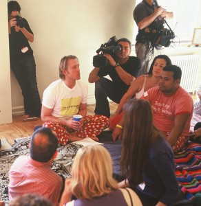 Reid leading a press conference about Cuddle Party