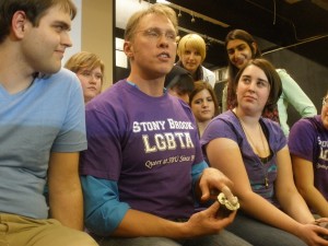 Reid Mihalk teaching safer sex with a cupcake and a finger cot at Stony Brook College in Long Island, NY