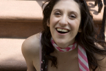 Sex educator Jamye Waxman smiling, wearing a striped scarf