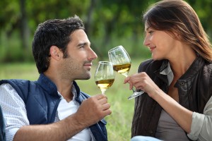 bigstock-Couple-drinking-wine-in-field-25327166
