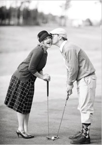 couple kissing while golfing