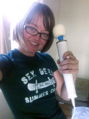 Sex educator Hunter Riley's selfie of her sporting her Sex Geek Summer Camp tshirt and her Hitatchi Magic Wand vibrator