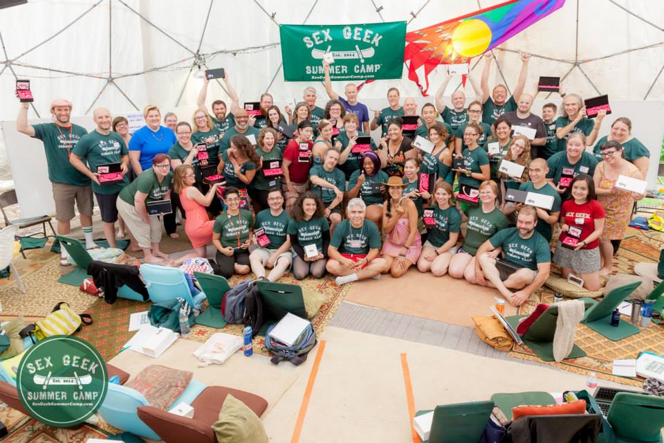 Sex Geek Summer Camp 2015 group photo of 60-plus sex educators proudly holding NJoy adult toys and posing for the camera