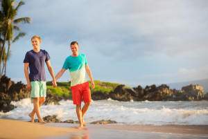 Happy gay couple on the beach