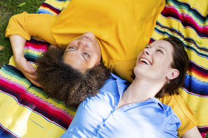 Two Woman Lying On Blanket