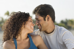 Hispanic couple smiling at each other