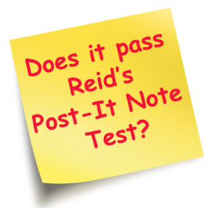 a yellow post-in note with "Does it pass Reid's post-it note test?" written on it in red marker