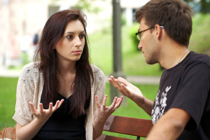 young attractive couple have an argument over something, outdoor