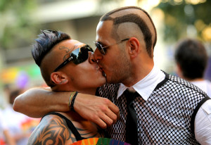 BARCELONA - JUNE 26: Two unidentified young men kiss during the