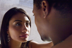 Multi-ethnic couple looking at each other