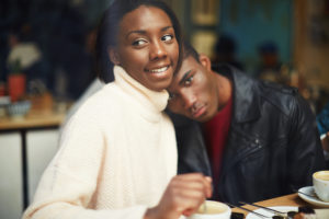Portrait of young couple in love at a coffee shop two people in cafe enjoying the time spending with each other young couple at san valentines day friends having coffee and enjoying themselves