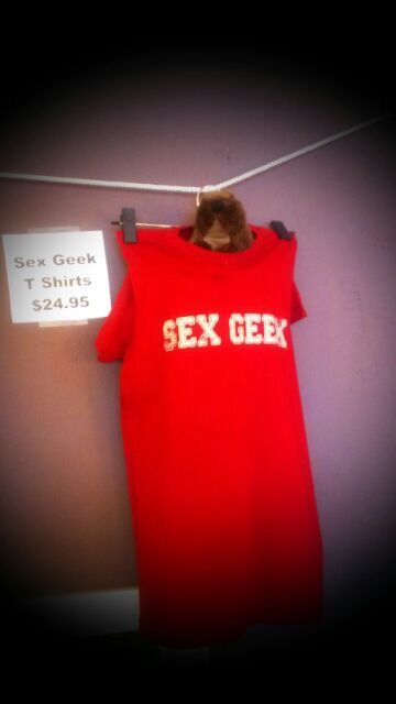 Sex and relationship educator Reid Mihalko of ReidAboutSex.com's famous Sex Geek tshirts hanging in Albuquerque's Self Serve Toys adult boutique