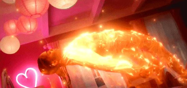 Black Lightning tv show GIF of woman glowing with electricity and floating in the air 