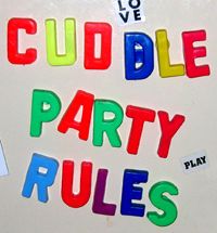 "Cuddle Party Rules" spelled out using colorful letter magnets on a refrigerator door.