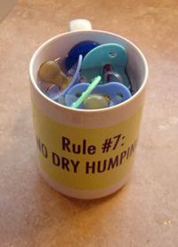 Cuddle Party Rule #7: No Dry Humping coffee mug filled with baby pacifiers