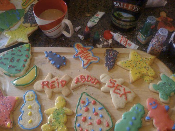 a tray of decorated gingerbread cookies with three of them having Reid's brand written across them.