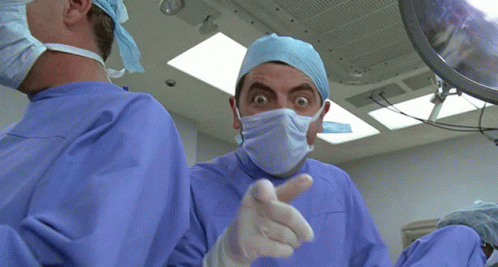 Mr Bean thumbs up as a doctor in surgery GIF
