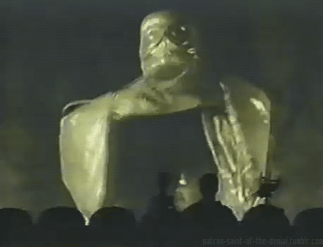 Mystery Science Theatre GIF of giant robot spreading its arms and saying "join us"