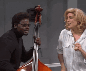 Man and woman scat singing while the man plays upright bass