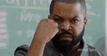 Ice Cube holding up three fingers GIF