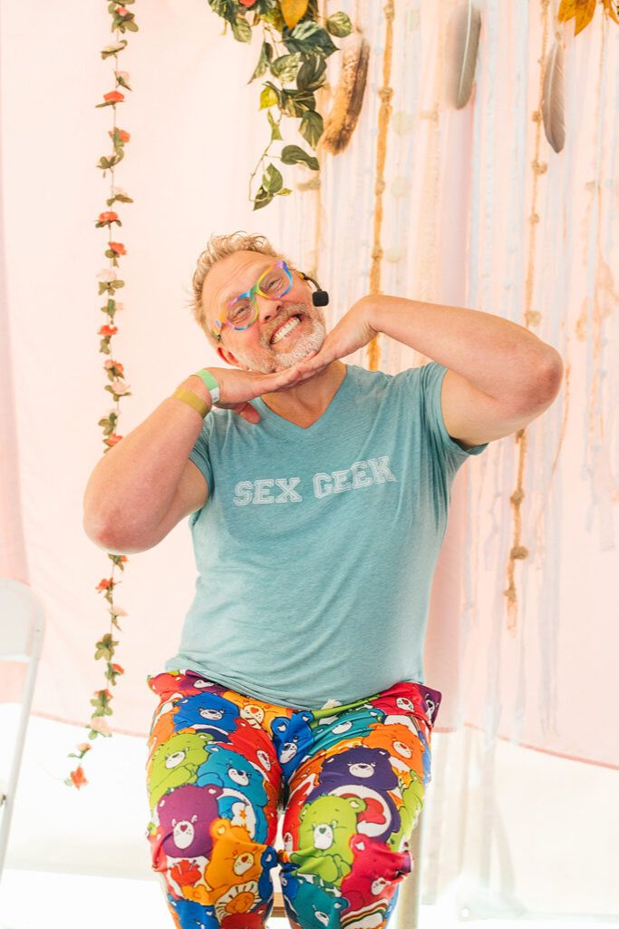 Reid teaching and looking silly wearing Care Bear pajama pants and a sex geek tshirt