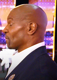 Terry Crews turning towards camera with a surprised face