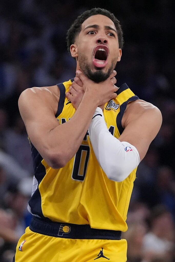 Indiana Pacers’ star point guard Tyrese Haliburton making a choking signal with his hands around his throat